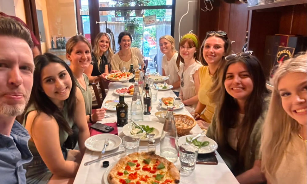 Students enjoying a meal together in Florence