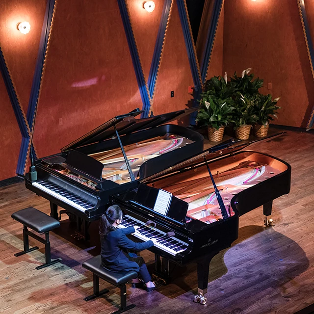 High-angle view of a piano recital in the PepsiCo Auditorium