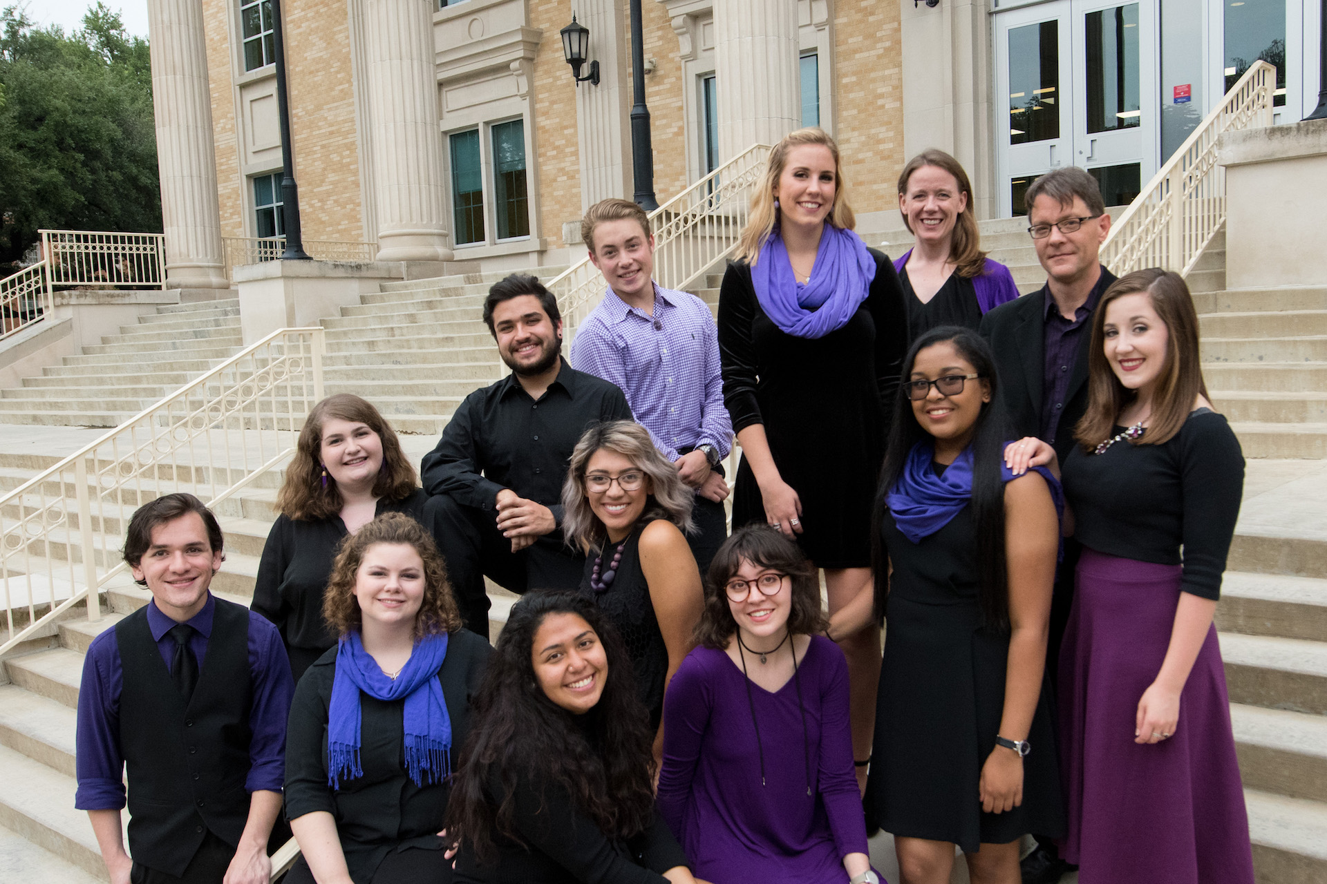 Vocal Jazz Ensemble posing on steps