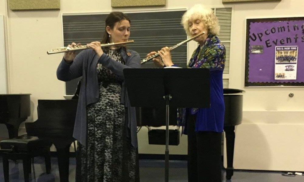 students playing their flutes