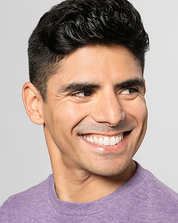 Domingo Estrada, Jr. wearing a light purple t-shirt