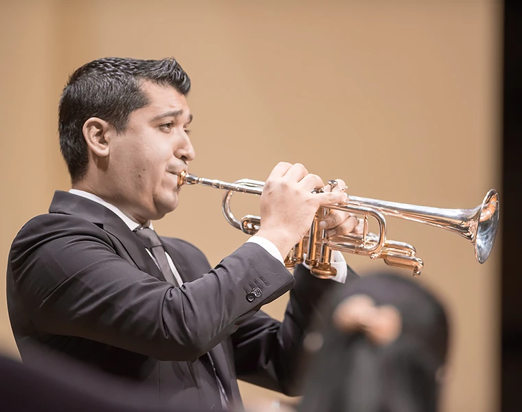 Pacho Flores plays a silver trumpet during the Latin American Music Festival