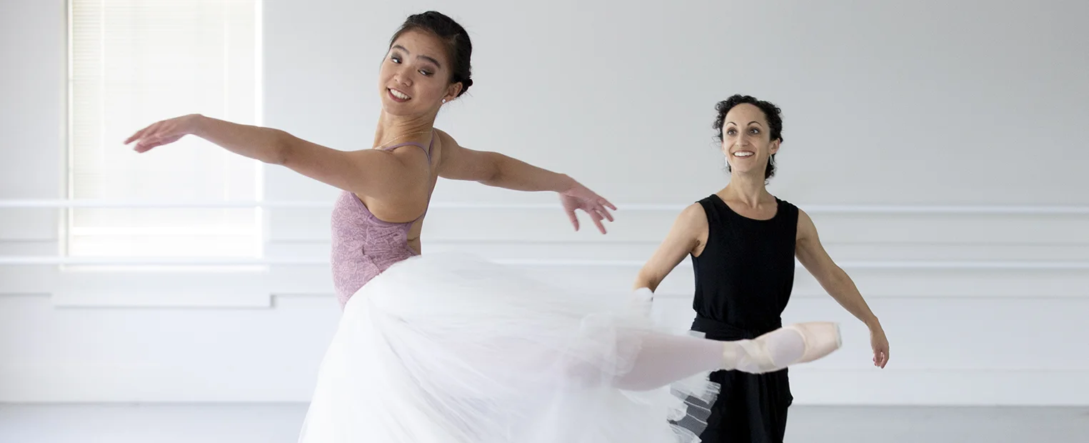 Jessica Zeller instructs a young ballet dancer