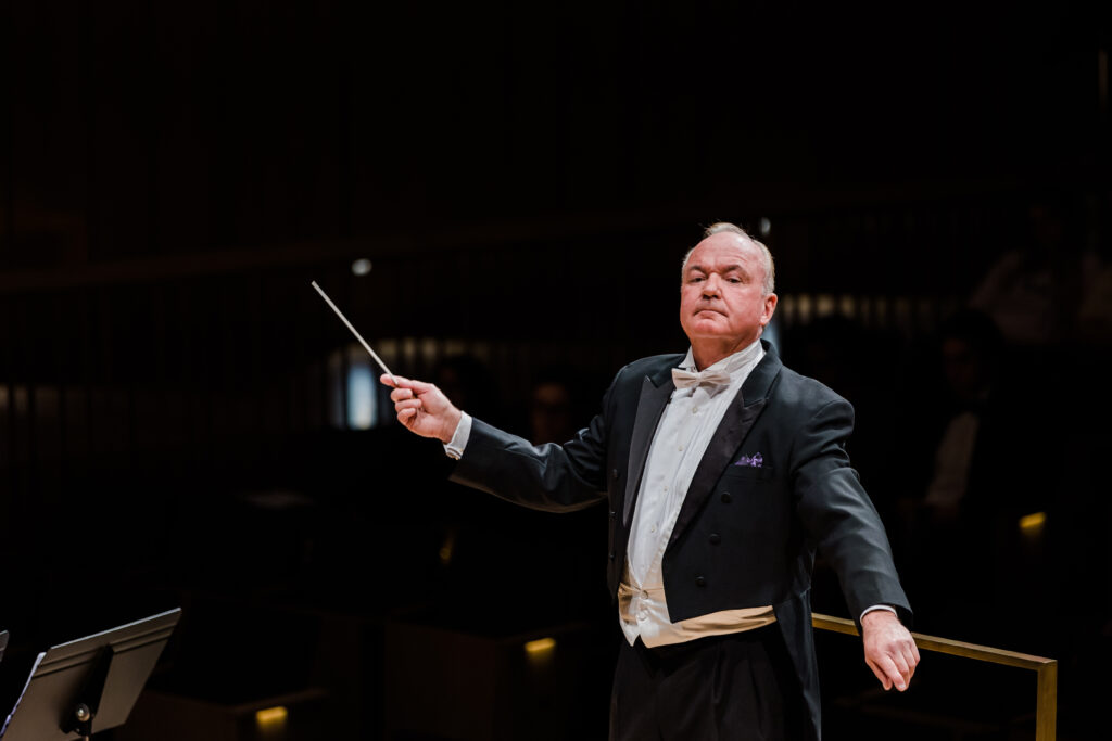 Image of Bobby Francis conducting the Wind Symphony Orchestra in the Van Cliburn Concert Hall at TCU.