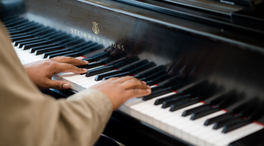 Image of performer playing the piano