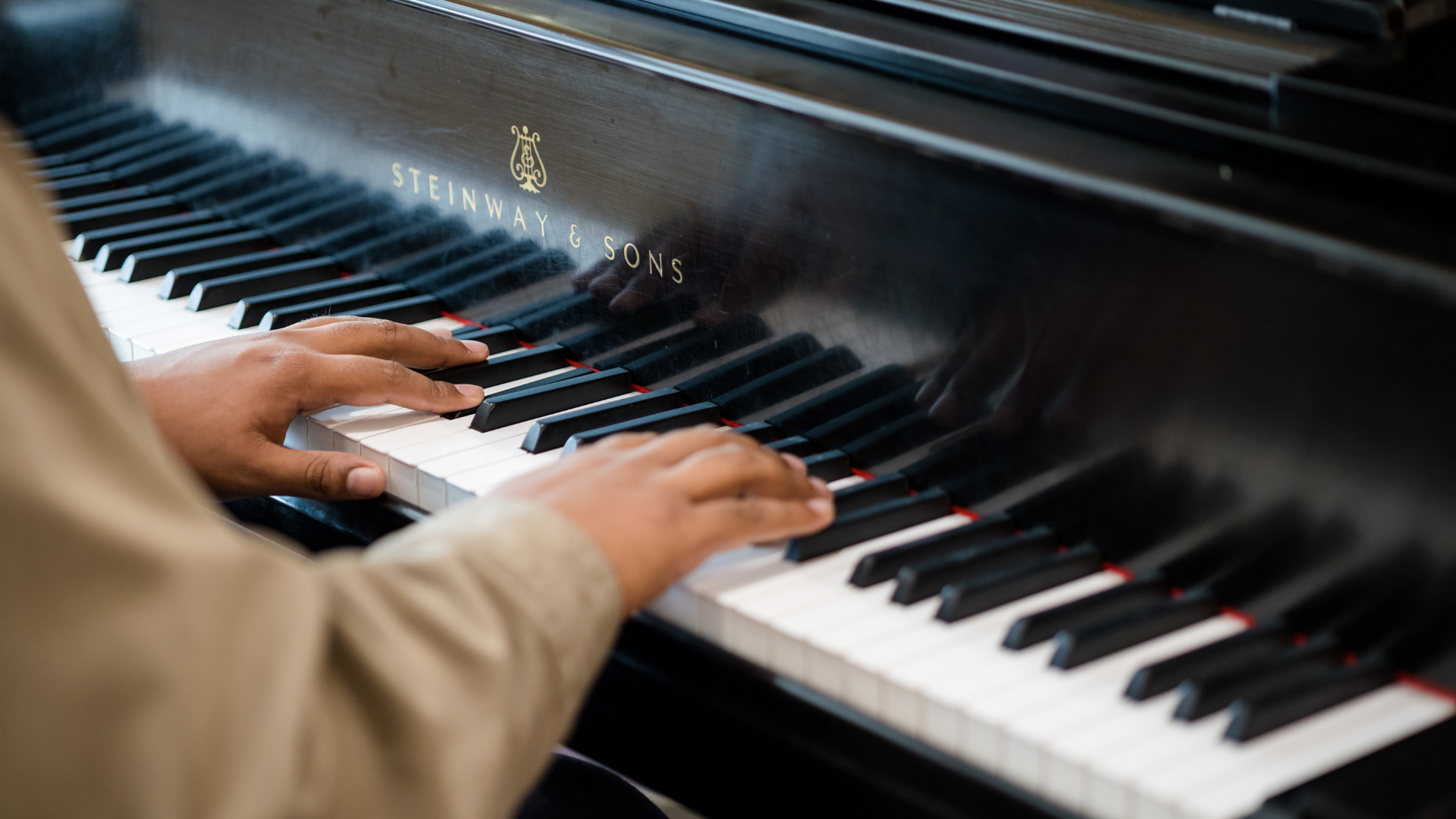 Image of performer playing the piano