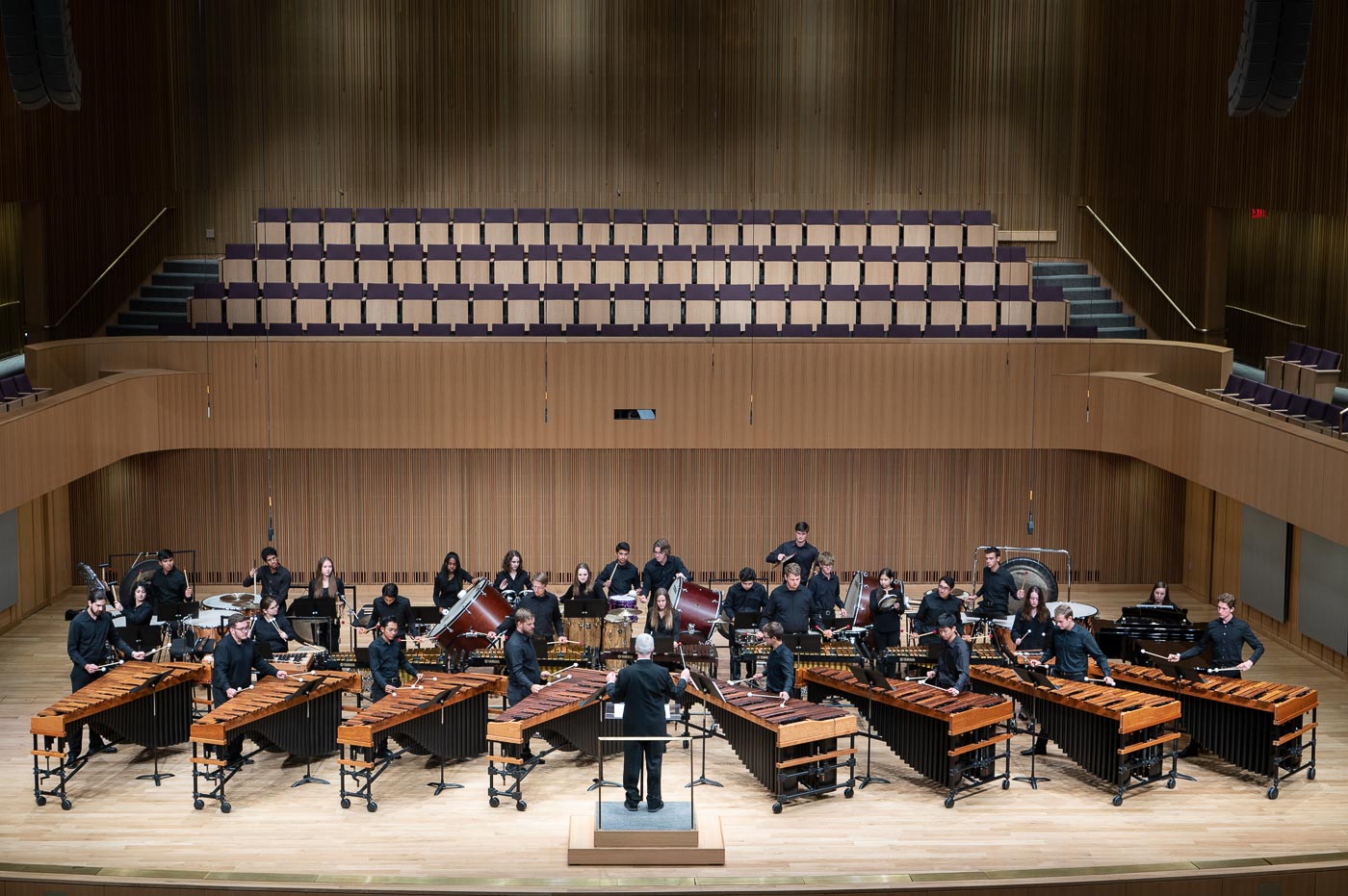 Image of the TCU Percussion Orchestra performing in the Van Cliburn Concert Hall.