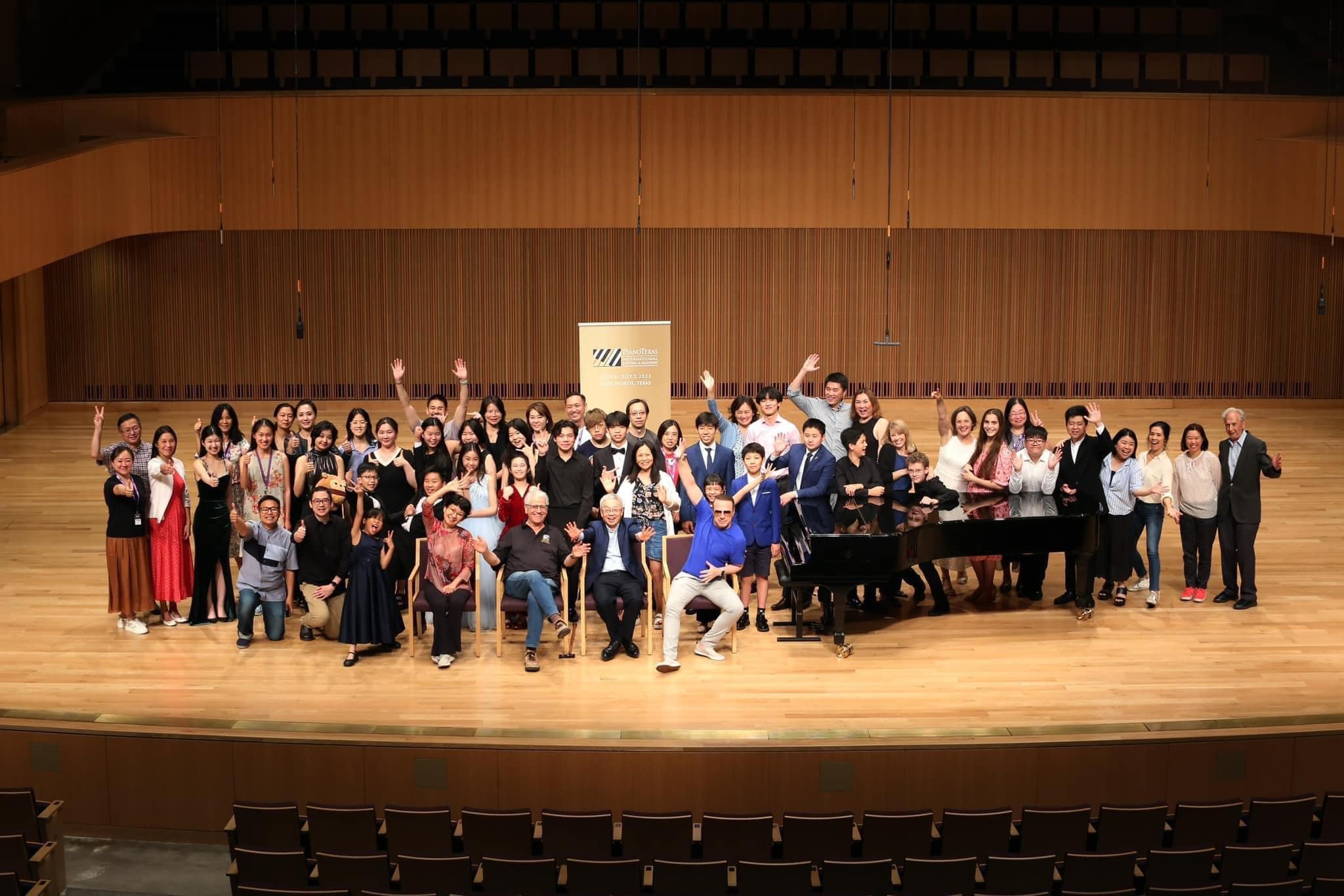 Group photo of PianoTexas participants on stage at the Van Cliburn Concert Hall at TCU. 