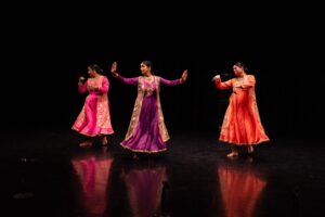 Three guest artists dancing in Erma Lowe Studio Theater.