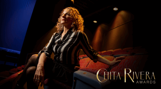 Suki John sitting in a theatre.