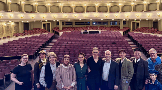 On the stage at Bass Hall with “Ellis Island: The Dream of America” cast. From left: Kaitlin Hatton (professional stage manager); Jennifer Engler (TCU theatre chair); Ethan Hyatt (current TCU student); Lana Hoover (professional actor); Lourdes Bradley (current TCU student); Stephanie Rhodes Russell (resident conductor of FW Symphony Orchestra); Peter Boyer (composer of “Ellis Island: The Dream of America”); Curtis Shideler (Theatre TCU alum); Alan Shorter (Theatre TCU faculty); Lucy Bennetch (child professional actor); Harry Parker (Theatre TCU faculty, director); Taylor Staniforth (Theatre TCU alum)